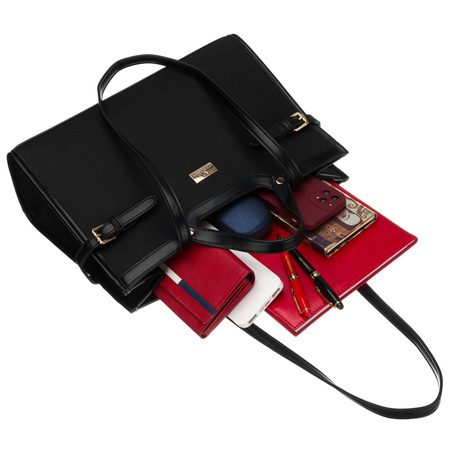 Schwarze Damenhandtasche mit Magnetverschluss, an bequemen Tragegriffen getragen – Peterson