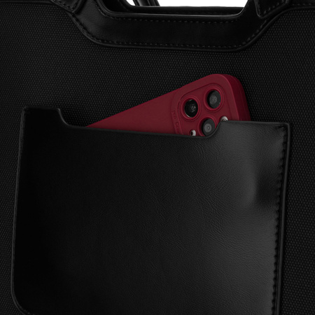 Schwarze Damenhandtasche mit Magnetverschluss, an bequemen Tragegriffen getragen – Peterson